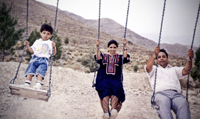 Saad swings with his parents